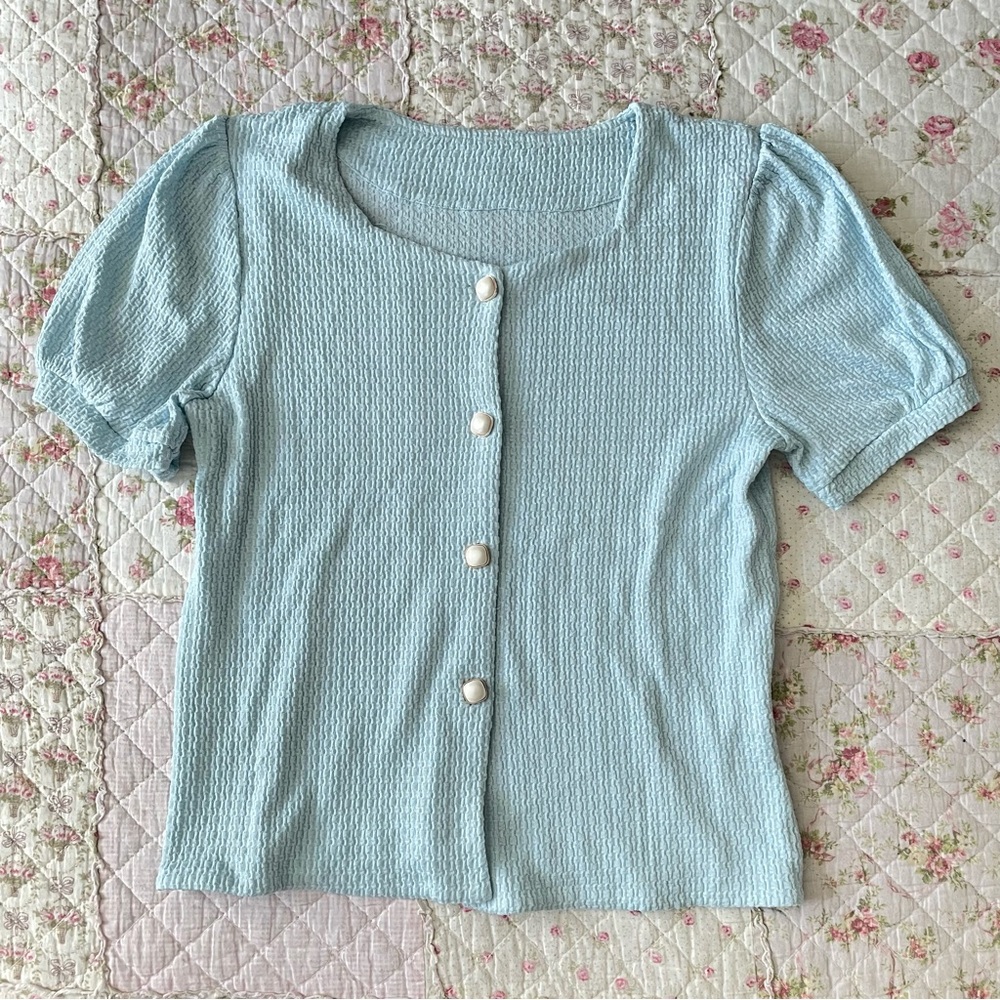 Blue waffle knot blouse with decorative buttons